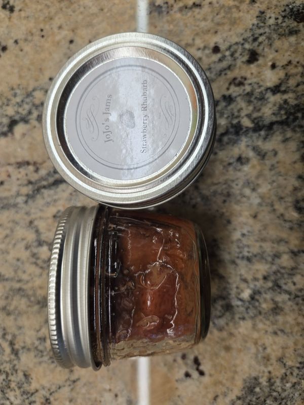 A pot of JoJo's Strawberry Rhubarb jam with its label