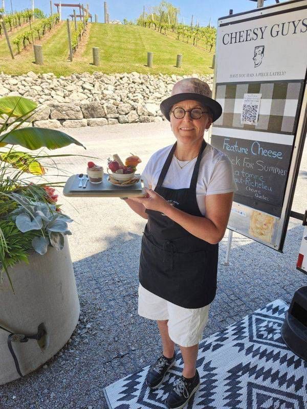 Mark Gibson and Dr. Johanna Cornelissen in front of the Cheese Tango trailer at the vineyard